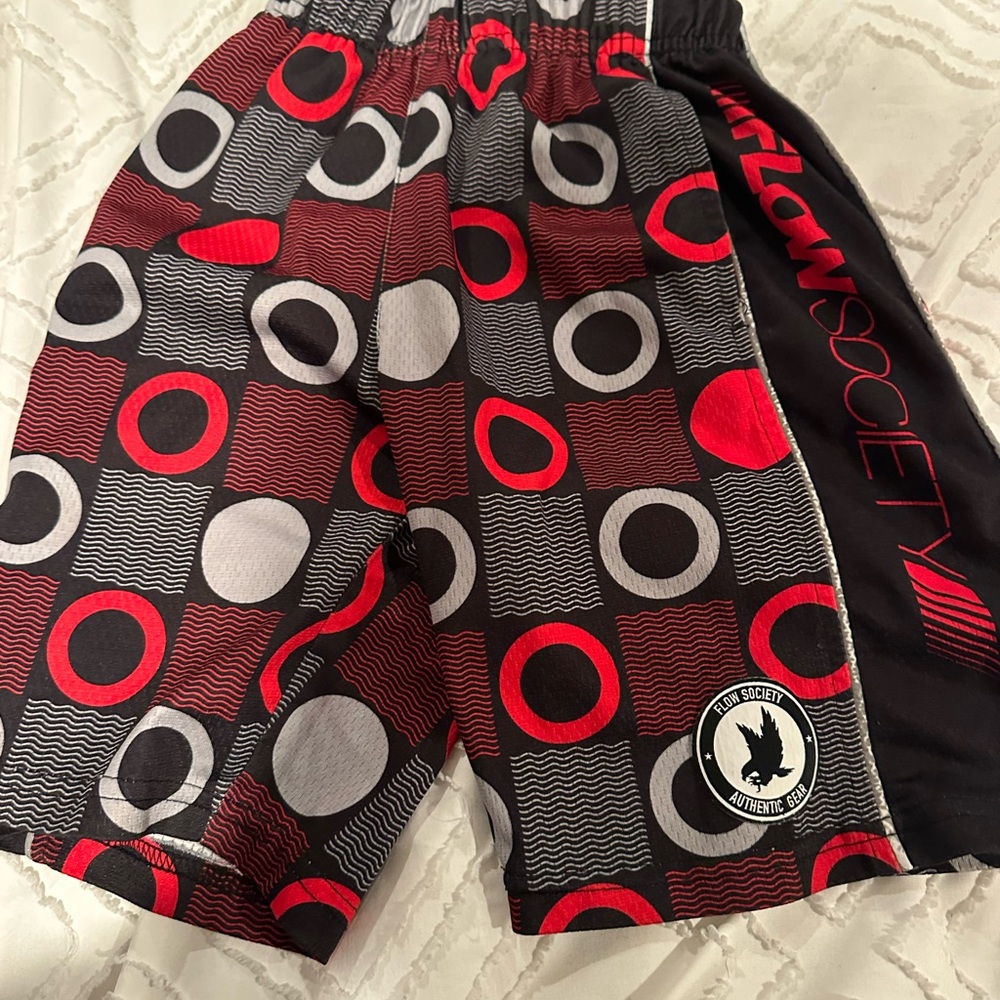 FLOW SOCIETY SHORTS boys size XS black, red and grey.